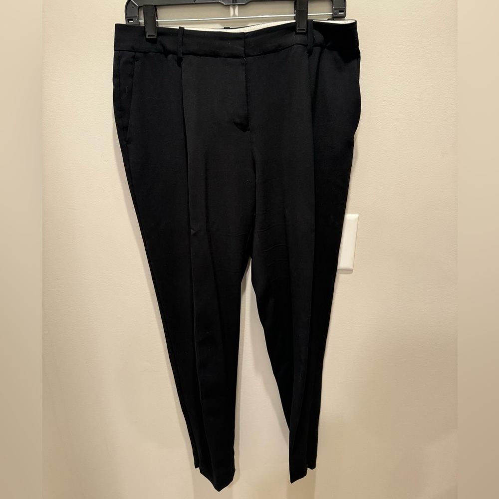 Black dress pants, loose fit very comfy
Size 6 
100% polyester